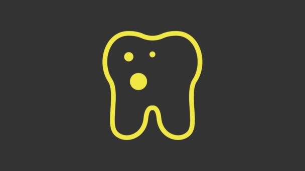 Diente amarillo con icono de caries aislado sobre fondo gris. Caries dental. Animación gráfica de vídeo 4K - Metraje, vídeo