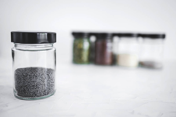 simple food ingredients concept, seed jars with sesame poppy pupmkin chia and flax seeds as important nutrient sources for nutrition shot on white background - Φωτογραφία, εικόνα