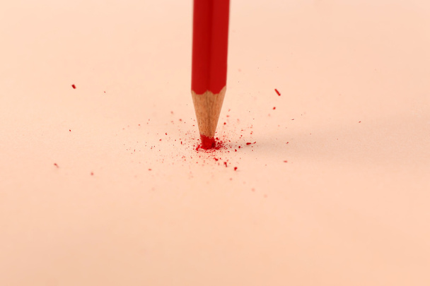 Breaking pencil on paper, close up - Фото, зображення