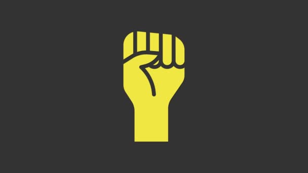 Żółta Podniesiona dłoń z zaciśniętą ikoną pięści na szarym tle. Protestujący podniósł pięść na demonstracji politycznej. Wzmocnienie pozycji. 4K Animacja graficzna ruchu wideo - Materiał filmowy, wideo