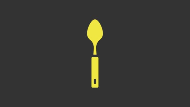 Желтая иконка ложки выделена на сером фоне. Кухонная утварь. Прибор для столовых приборов. Видеографическая анимация 4K - Кадры, видео