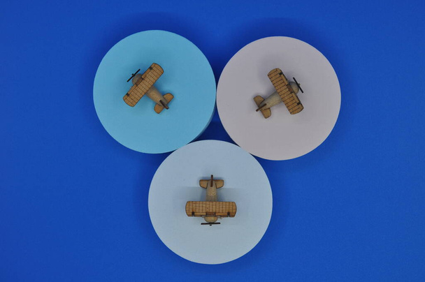 Close up creative shots of small wooden plane models handcrafted from wood, around 3cm X 2cm in size - 写真・画像