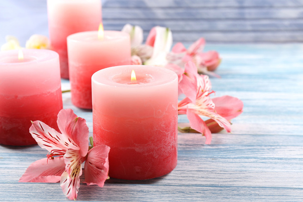 Beautiful candles with flowers on wooden background - Zdjęcie, obraz
