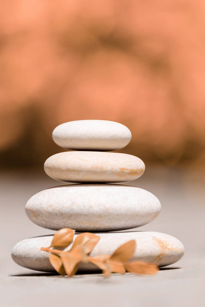 balancing pile of pebble stones, like ZEN stone, outdoor in springtime, spa wellness tranquil scene concept, soul equanimity mental calmness picture - Photo, Image