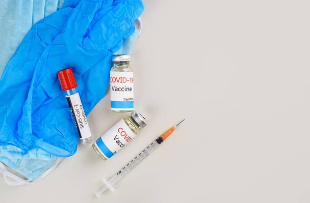 Covid-19 Corona Virus 2019-ncov vaccine vials medicine drug bottles syringe injection. Vaccination, immunization, treatment to cure Covid 19 Corona Virus infection. Medicine infectious concept. - Photo, Image