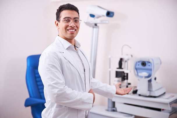 Friendly smiling ophthalmologist looking at the camera - Photo, Image