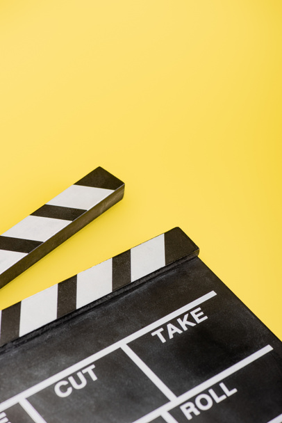 close up view of clapperboard on yellow, cinema concept - Photo, Image