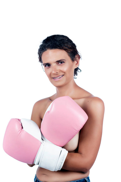 Nude young woman with pink boxing gloves, depicting a fight against breast cancer awareness. - Foto, immagini