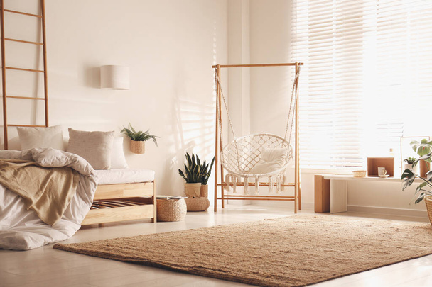 Comfortable hammock chair in stylish room. Home interior - Foto, Imagen