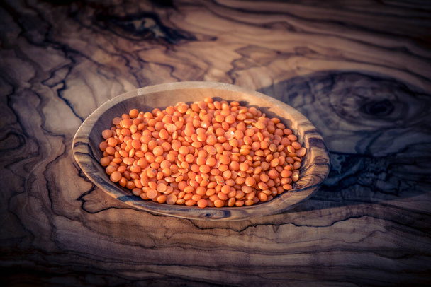 red lentils on olive wood - Photo, Image