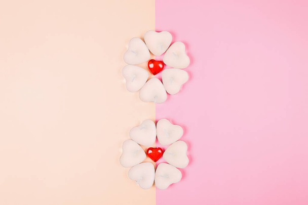 Valentine's Day, composition of hearts on a pink background. View from above. Space for text, flat lay - Fotoğraf, Görsel