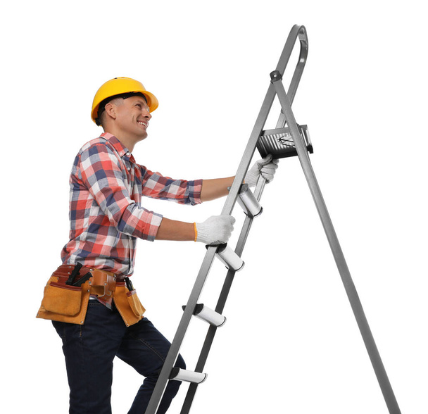 Professional constructor climbing ladder on white background - Foto, Imagen