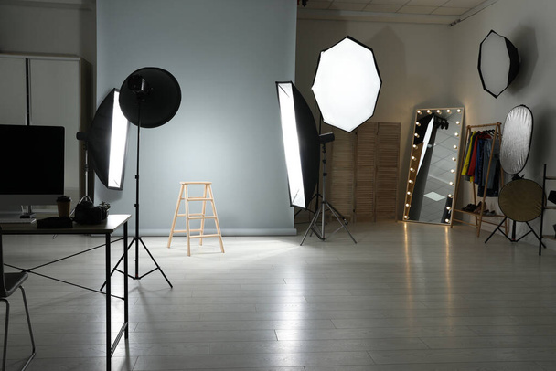 Interior of modern photo studio with professional equipment - Foto, Imagem