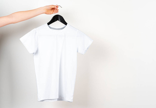 Close up of a white color t-shirt - Photo, image