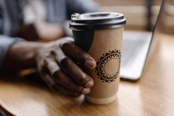 close up of  hands holding coffee cup with hot drink - Foto, imagen
