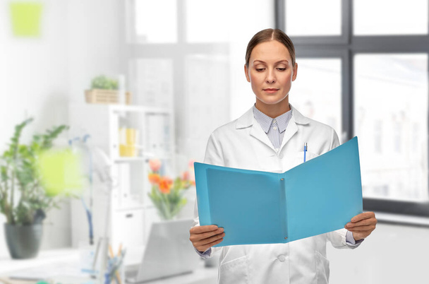 female doctor with folder at hospital - Photo, Image