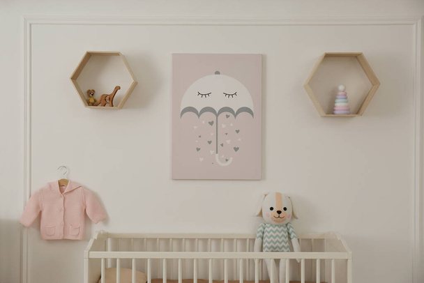 Modern baby room interior with crib and toys - Фото, зображення
