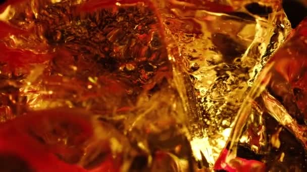 drink with ice cubes, rotates macro view - Footage, Video