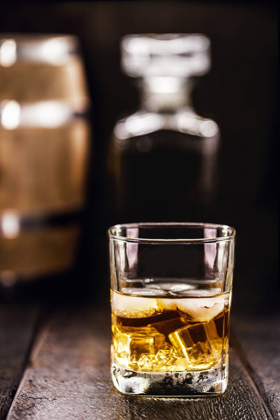 glass of aged whiskey, grain distilled alcohol, with malt, aged in barrels - 写真・画像