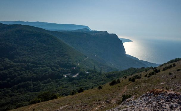 Mediterranean landscape. Forested rocks of the Black Sea coast of the southern coast of the Crimean Peninsula on a clear sunny day. - Fotografie, Obrázek