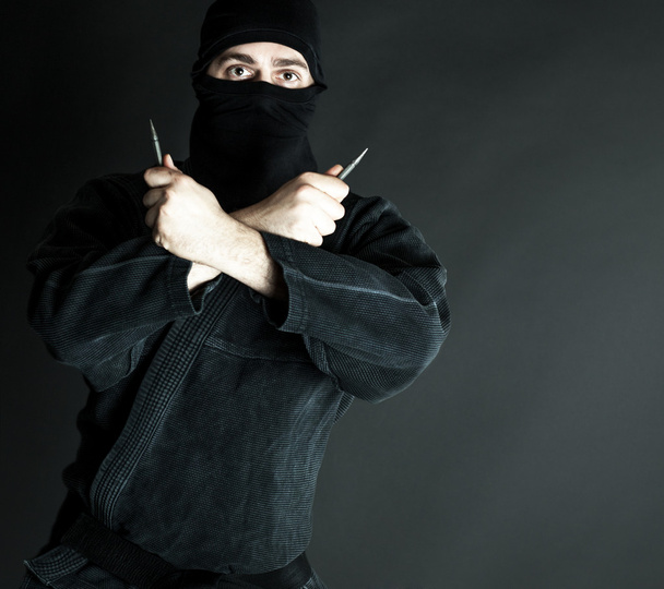 Ninja s trowing čepelí - Fotografie, Obrázek