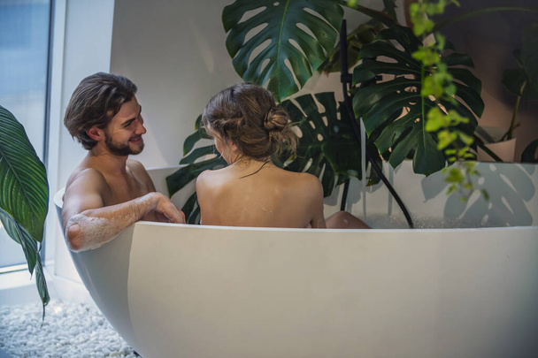 young couple bathes in the bath - 写真・画像