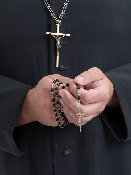 Priest with rosary - 写真・画像