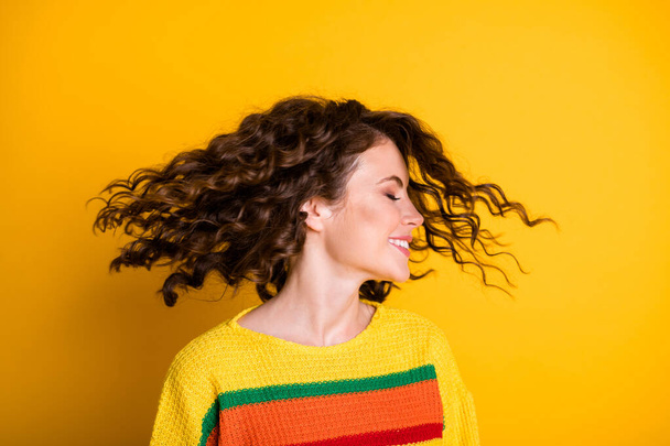 Profile photo of sweet cute woman dressed casual colorful pullover hair sides isolated yellow color background - Fotoğraf, Görsel
