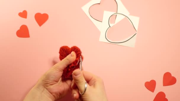 Handmade heart shaped pompom video instruction. Top view. Handmade crafts  - Footage, Video