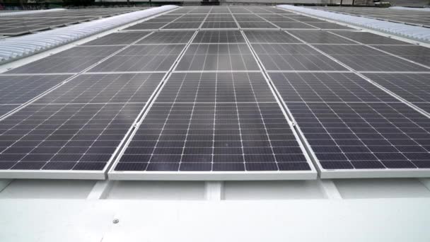 Solar panels on the roof of an industrial warehouse. Energy efficiency for a more sustainable and environmentally friendly world. - Footage, Video