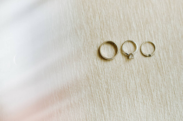 Close-up of two gold wedding rings for a wedding. - Фото, зображення