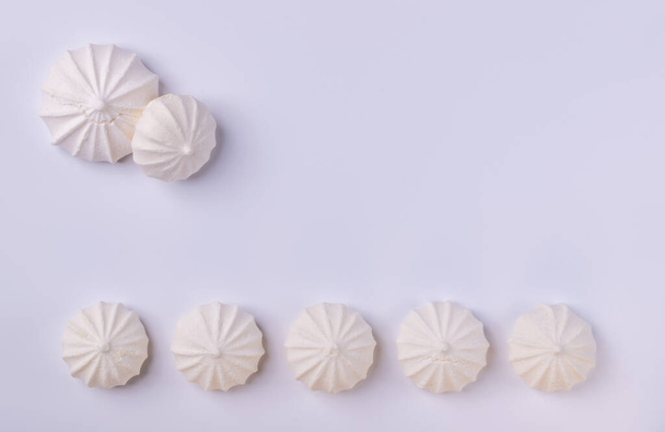 Meringue cookie on white background, for backgrounds or textures , copy space. - Photo, Image