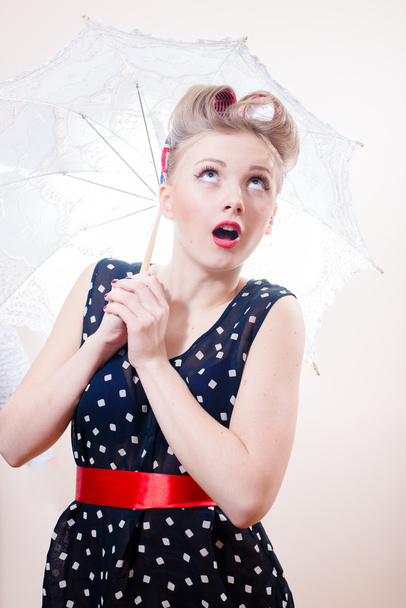 Woman with umbrella looking aside - Foto, Imagem
