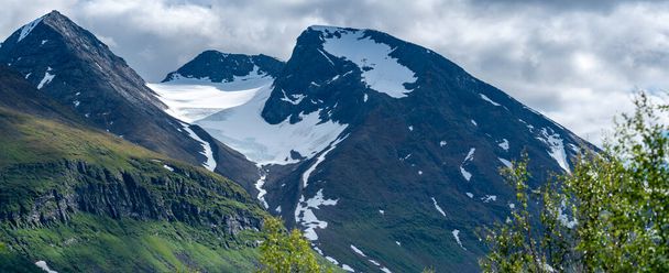 Close up landscape of Akka Mountain Massif and Top Glacier With snow cover in Swedish Big Lake National park North of Arctic Circle in Lapland, Sweden. - Photo, Image