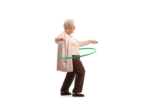 Grandma spinning hula hoop isolated on white background - Foto, Imagem
