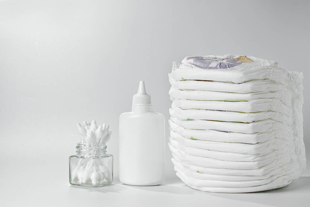 Hygiene and body care products for the baby. Diapers and panties, cream, pacifier and talcum powder. - Foto, afbeelding