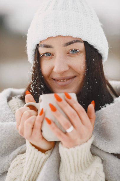 Outdoor photo of cozy female in winter forest - Photo, image