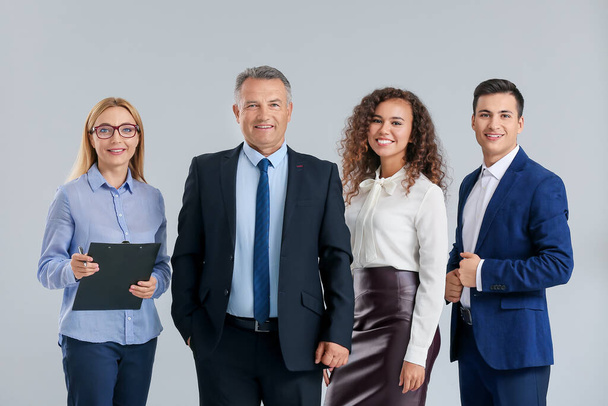 Portrait of business people on grey background - Photo, Image
