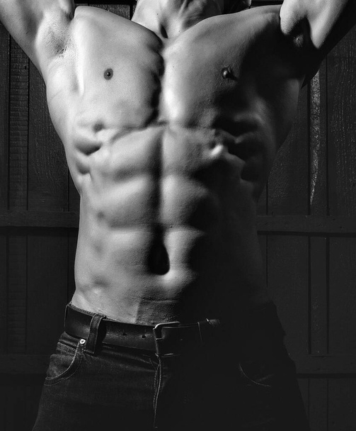 Muscular young man with athletic bare body. - 写真・画像