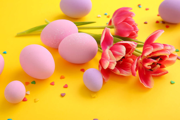Composition with beautiful Easter eggs on color background - Foto, Imagen