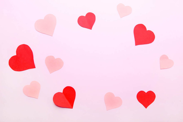 Pink background from different paper hearts. Valentine day. - Photo, Image