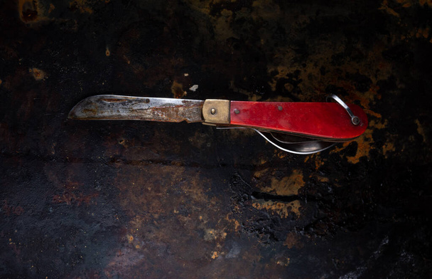 Old Soviet knife. Old rusty knife made in the USSR. Rusty background. - Fotoğraf, Görsel
