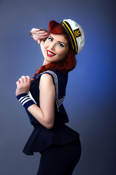 Sailor pin up tyttö tervehdys
 - Valokuva, kuva
