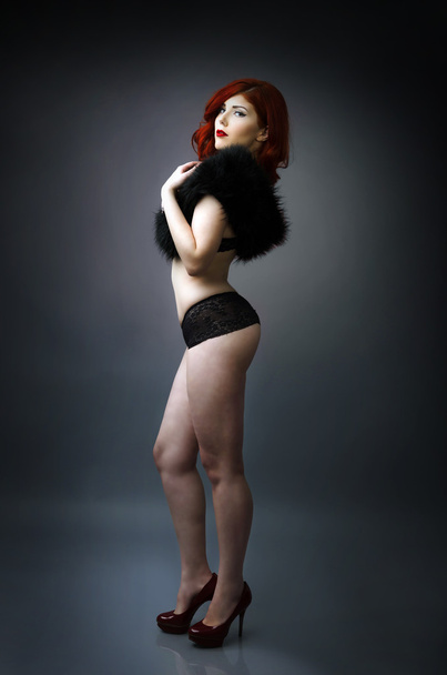 Studio portrait of a confident curvy woman posing in lingerie - Foto, Imagem