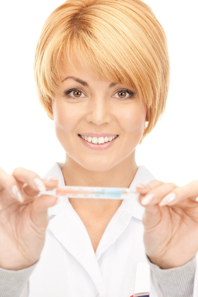 Attractive female doctor with thermometer - Photo, image