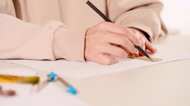 cropped view of woman using ruler and drawing lines on paper - Footage, Video