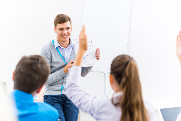 teacher talking with students - Фото, изображение