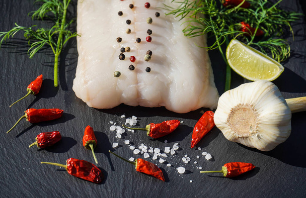 Fresh atlantic wolffish Steak with herbs and spices - Foto, imagen