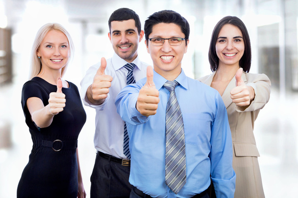 Business people showing thumbs up sign - Foto, Bild