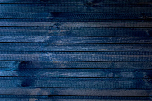 dark blue wooden background. texture, pattern. close-up, macro - Fotó, kép